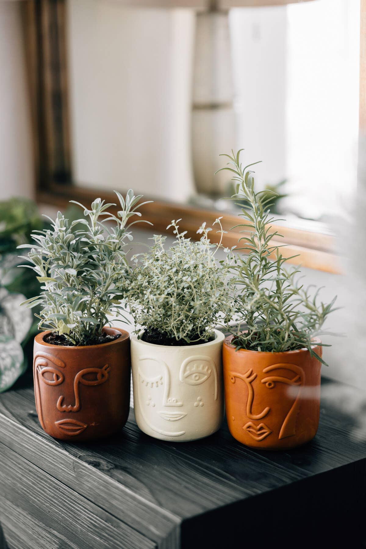 Ten Thousand Villages - Winky Face Cream Terracotta Planter 4" Ten Thousand Villages