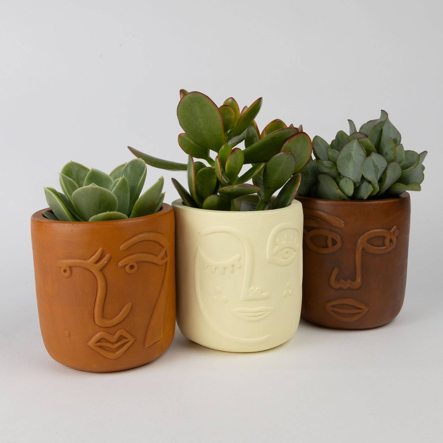 Ten Thousand Villages - Winky Face Cream Terracotta Planter 4" Ten Thousand Villages